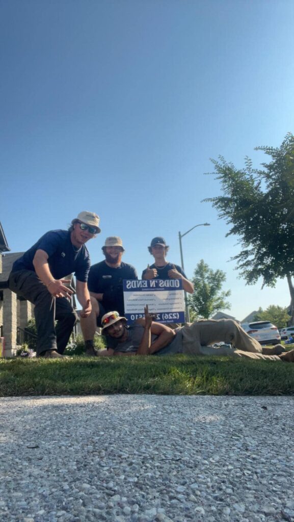 landscape crew with sign